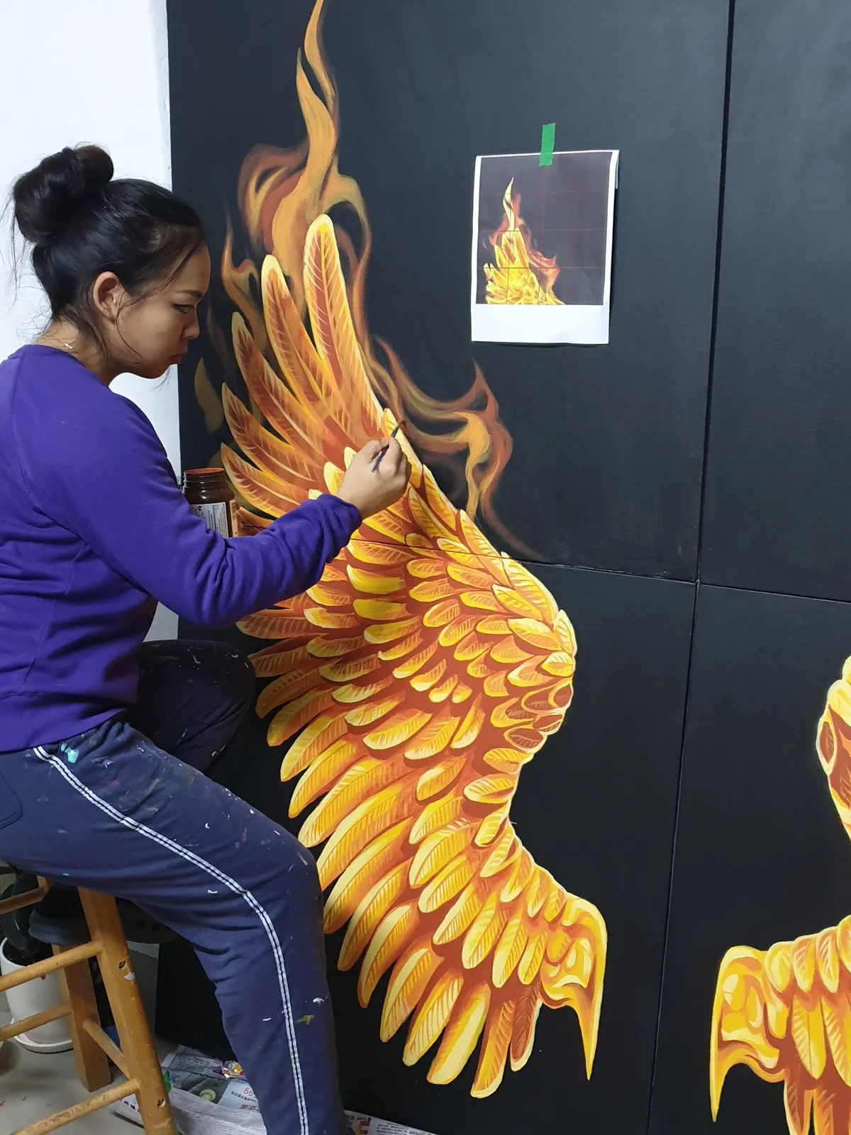 Anqi painting golden wings