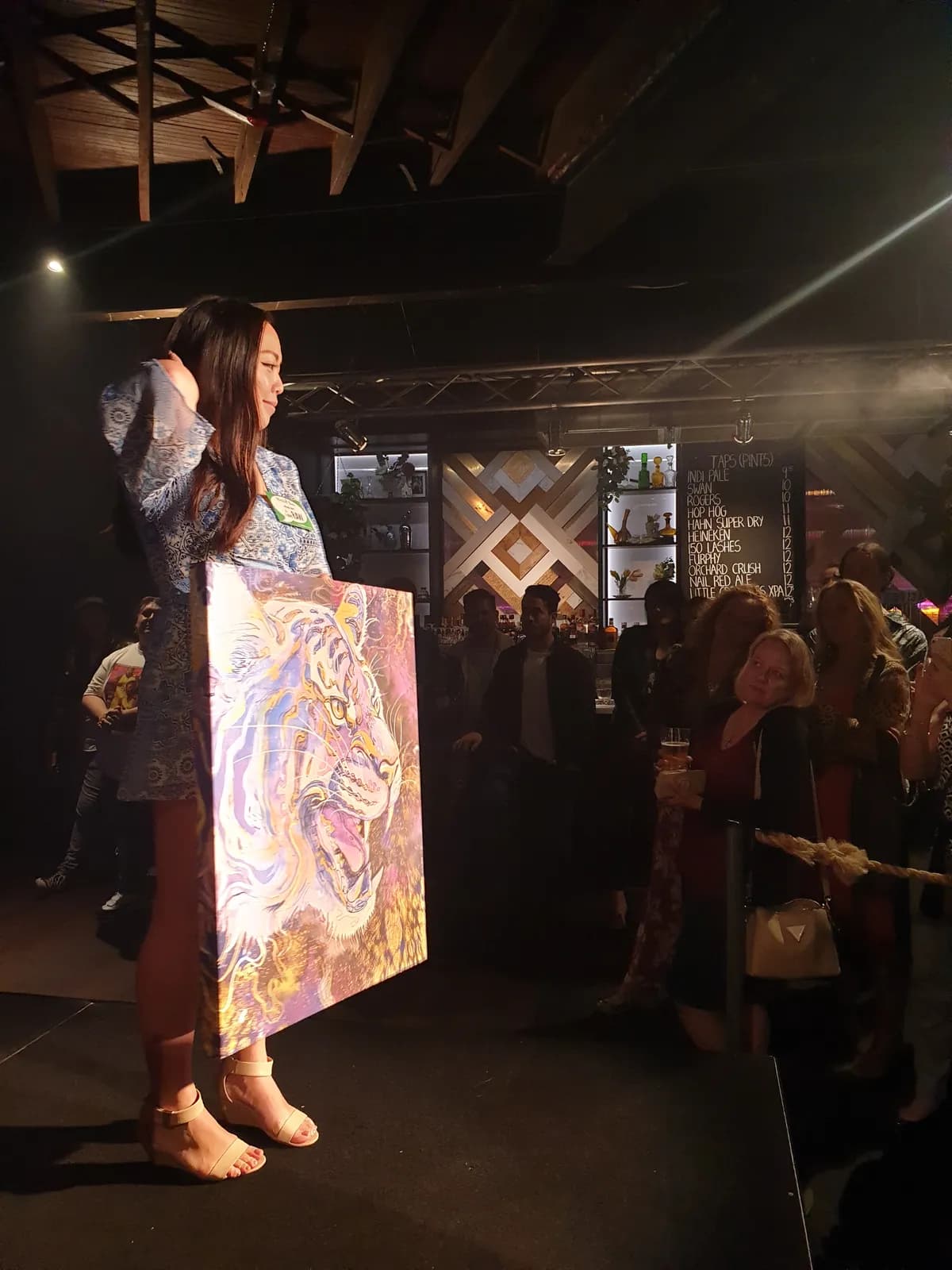 Anqi live painting at an event