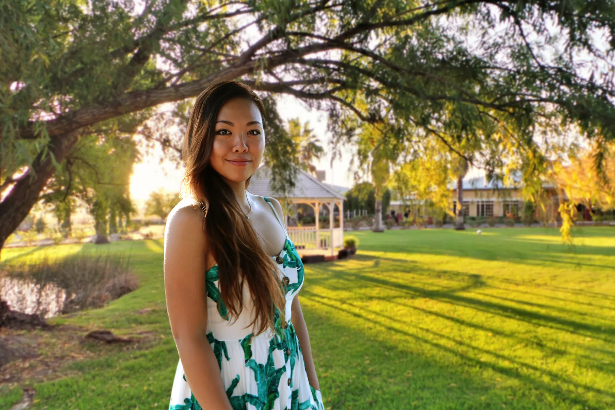 Anqi standing in a sunny park